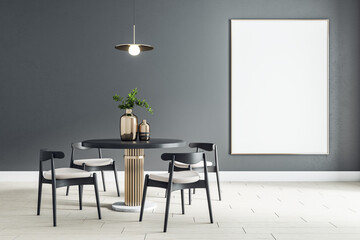 Blank white poster on black wall in modern dining room with round table and black wooden chairs on ceramic tiles floor. Mock up