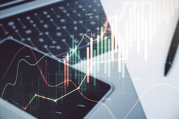 Multi exposure of abstract financial graph on laptop background, financial and trading concept