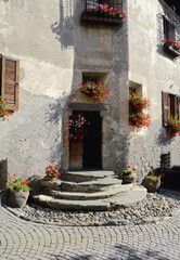 the village of Combo with picturesque and flowery mountain corners and the bell tower of the Church...