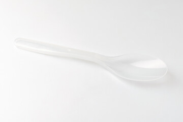 Plastic spoon on white background