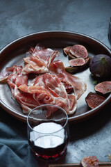 Spanish tapas and pintxos with Jamon and soft cheese, wine, dinner