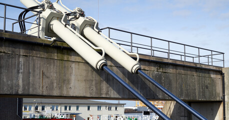 Large hydraulic cylinders for moving a swing bridge over a harbor basin