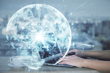 Multi exposure of woman hands typing on computer and business theme hologram drawing. Success concept.
