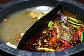 close up traditional Chinese two tastes (double-flavoured) hotpot. 