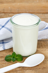 Obraz na płótnie Canvas Natural yogurt breakfast healthy organic eating yoghurt food wooden board portrait format