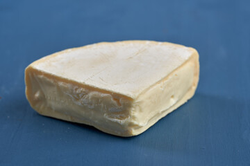 Camembert cheese on blue