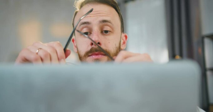 Handsome Confident Young Bearded Married Man Taking Off His Glasses And Closing Laptop When Finished Work On It ,work At Home Concept,close Up