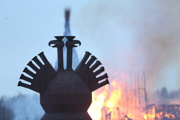 Symbol of Russia: two-headed eagle. Maslenitsa 2021. Traditional national holiday, folk game in...