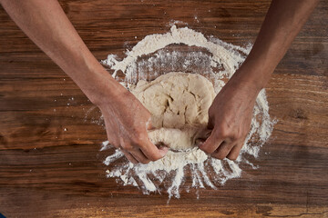 Woman kneading dough
