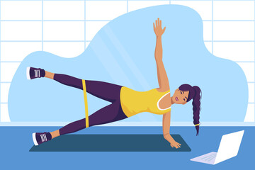 A girl performs an exercise with an elastic band