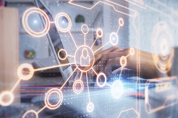 Double exposure of woman hands typing on computer and social network theme hologram drawing. People media concept.