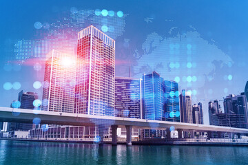 Fototapeta premium Skyscrapers of Dubai business downtown. International hub of trading and financial services. Social network icons hologram, concept of people connection. Double exposure. Dubai Canal waterfront.