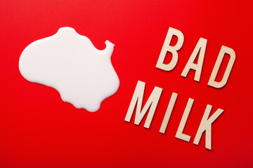 bad milk word letter text lactose intolerance allergy. milk splatter. avoid dangerous dairy