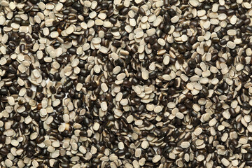 Close up of Organic split black urad dal (Vigna mungo) with shell Full-Frame Background. Top View