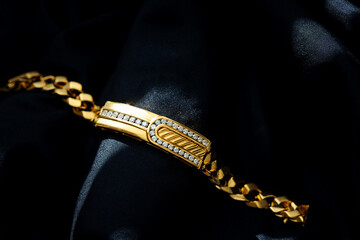 gold with diamond bracelet isolated on black background