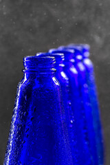 Naklejka na ściany i meble Blue glass bottles