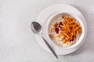 rice pudding with Norwegian brunost traditional brown cheese and raspberry jam