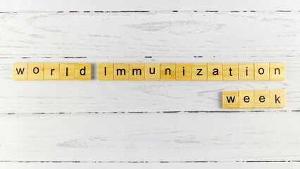 World Immunization Week.words from wooden cubes with letters