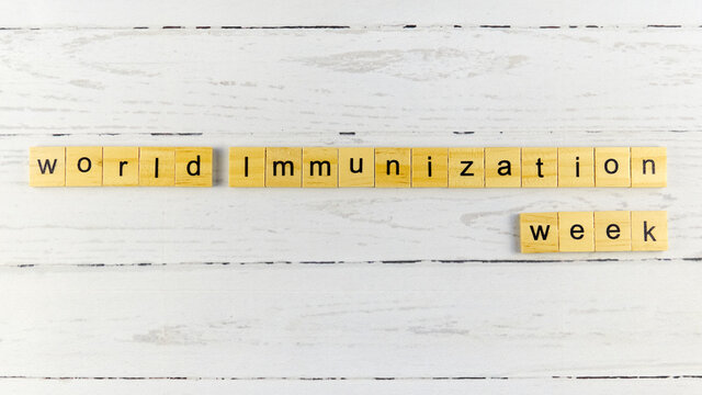 World Immunization Week.words from wooden cubes with letters