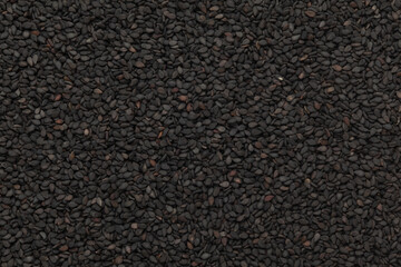 Close-Up of Organic Black Sesame seeds (Sesamum indicum) or Black Til with shell Full-Frame Background.  Top View