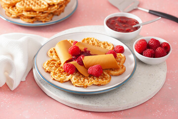 waffles with Norwegian brunost traditional brown cheese and raspberry jam