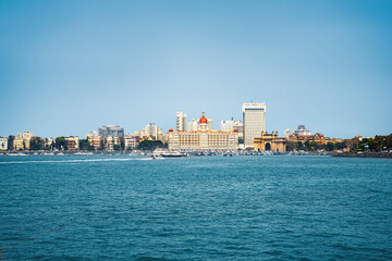 Fototapeta na wymiar view of Mumbai city from sea, Beautiful view of the Gateway of India and famous luxury hotel and city buildings cityscape