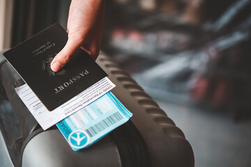 People holding passports and coronavirus vaccination card, map for travel with luggage for the trip. Covid-19 around the world
