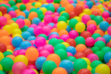 Fototapeta na wymiar Multi-colored plastic balls. A children's playroom.