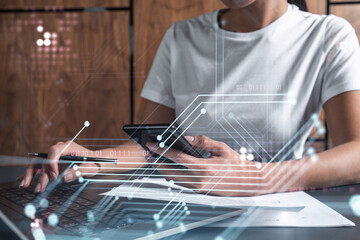 Woman hands typing the keyboard to create innovative software to change the world and provide a completely new service. Close up shot. Hologram tech graphs. Concept of Dev team. Casual wear.