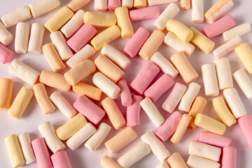 Colorful marshmallows on a light background. Close-up. Selective focus.