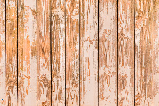 Brown planks of fence surface with natural pattern, wood texture background © Andrey