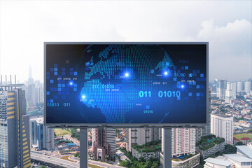 Obraz premium World planet Earth map hologram on billboard over panorama city view of Kuala Lumpur, Malaysia, Asia. The concept of international connections and business.