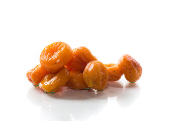 delicious dried apricots in a bowl on white background