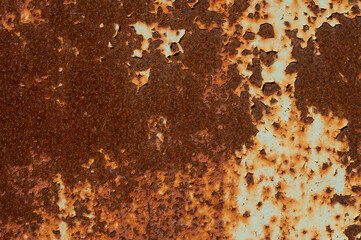 Textured grunge background red peeling paint with rust on old metal surface
