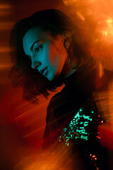 Portrait of woman in color light. Night party mood