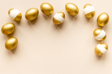 Set of golden eggs with space for text. Easter decoration. Overhead view
