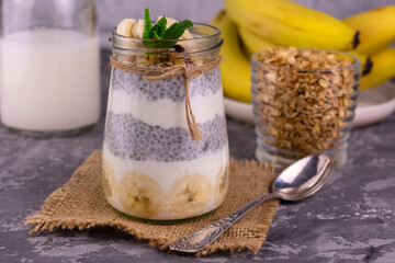 Banana chia pudding with granola in a jar.