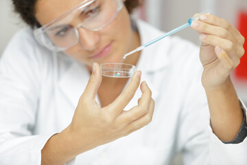 young woman with genetic research in the laboratory research