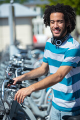 young attractive student is renting bike