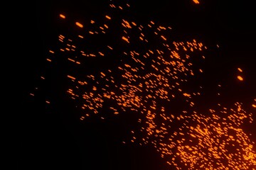 Fire sparks particles on a black background 3D rendering