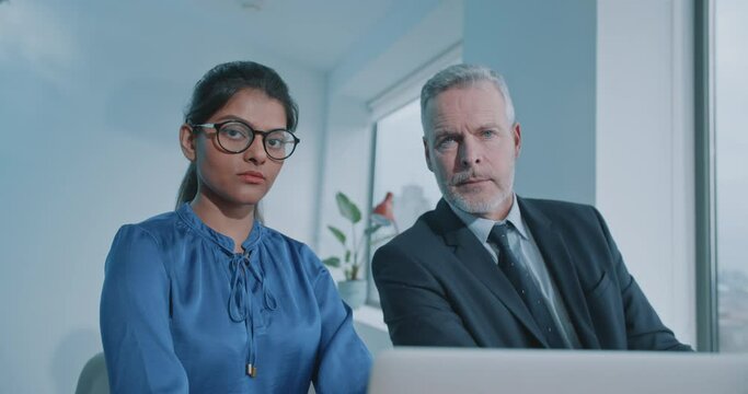 Multi racial staff members of international company looking at the camera