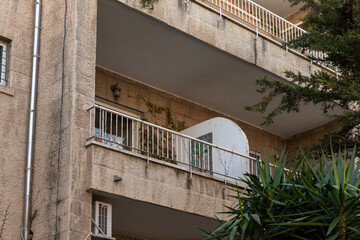 Evening  view of a decorative balcony in an apartment building in the old district of Jerusalem...