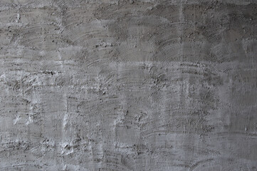 Texture of fresh concrete wall on construction site, fresh plastered cement wall.Gray blank cement textured or plaster wall abstract art pattern texture for background creative work with copy space