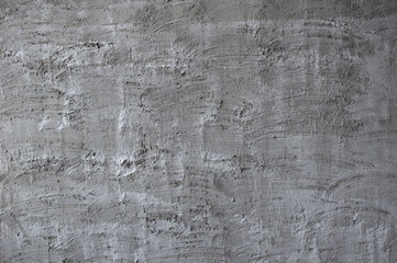 Texture of fresh concrete wall on construction site, fresh plastered cement wall.Gray blank cement textured or plaster wall abstract art pattern texture for background creative work with copy space