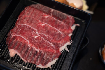 Freshly thin beef prepared for hot pot and Japanese sukiyaki.