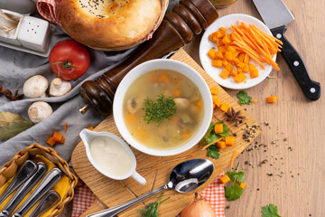 Vegetable vegetarian soup with mushrooms carrots and dill