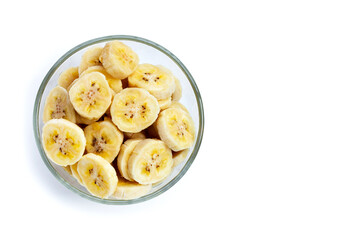 Banana slices in glass bowl on white