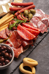 Charcuterie board with chorizo, jamon, pork sausage with pepper, fuet, cheese