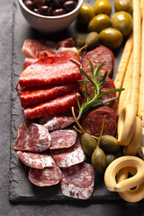 Close up shot of charcuterie board with spanish jamon, fuet, cheese and berries