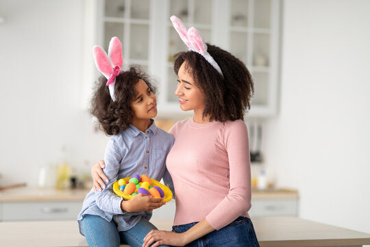 Black girl and lady wearing bunny ears on Easter day
